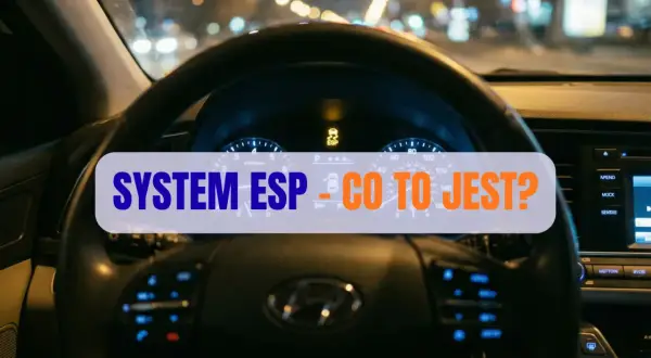 Widok na deskę rozdzielczą samochodu nocą. Na ekranie świeci się kontrolka ESP, a na kierownicy napis "SYSTEM ESP - CO TO JEST?".